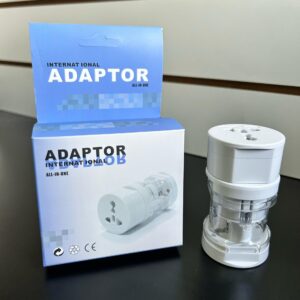 1075 - ADAPTADOR INTERNACIONAL CAJA CELESTE REDONDO